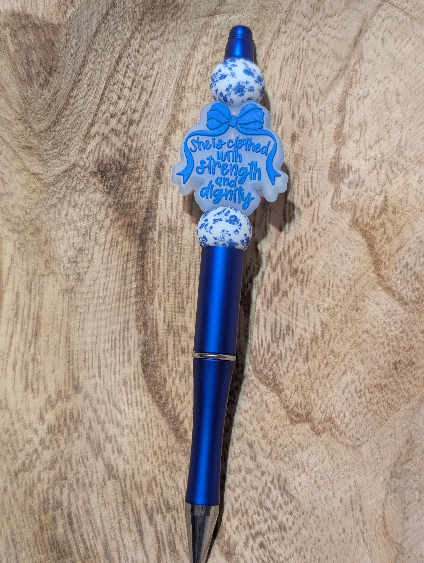 She is clothed with strength and dignity pen